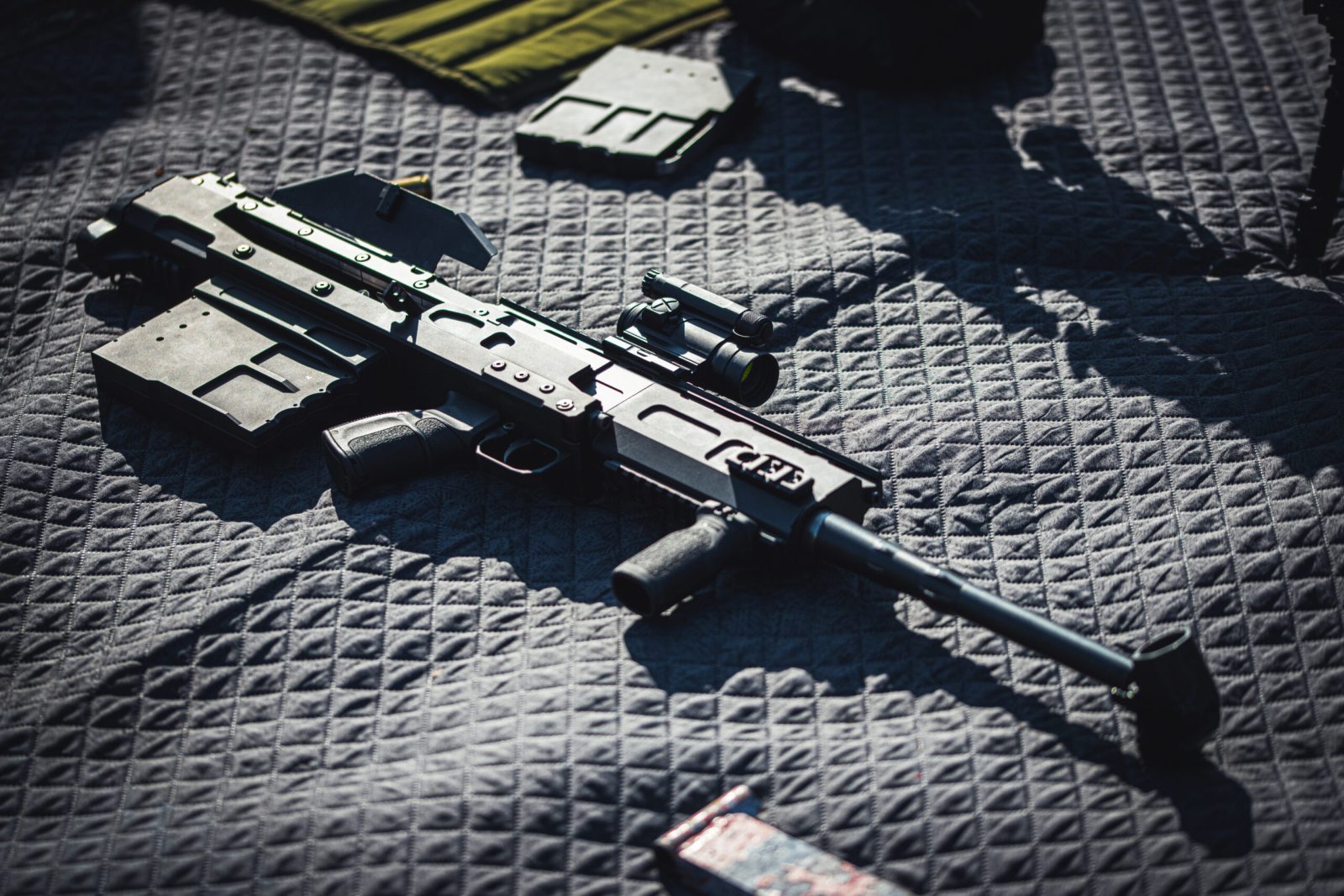 HH50 with spare magazine and field kit laid out