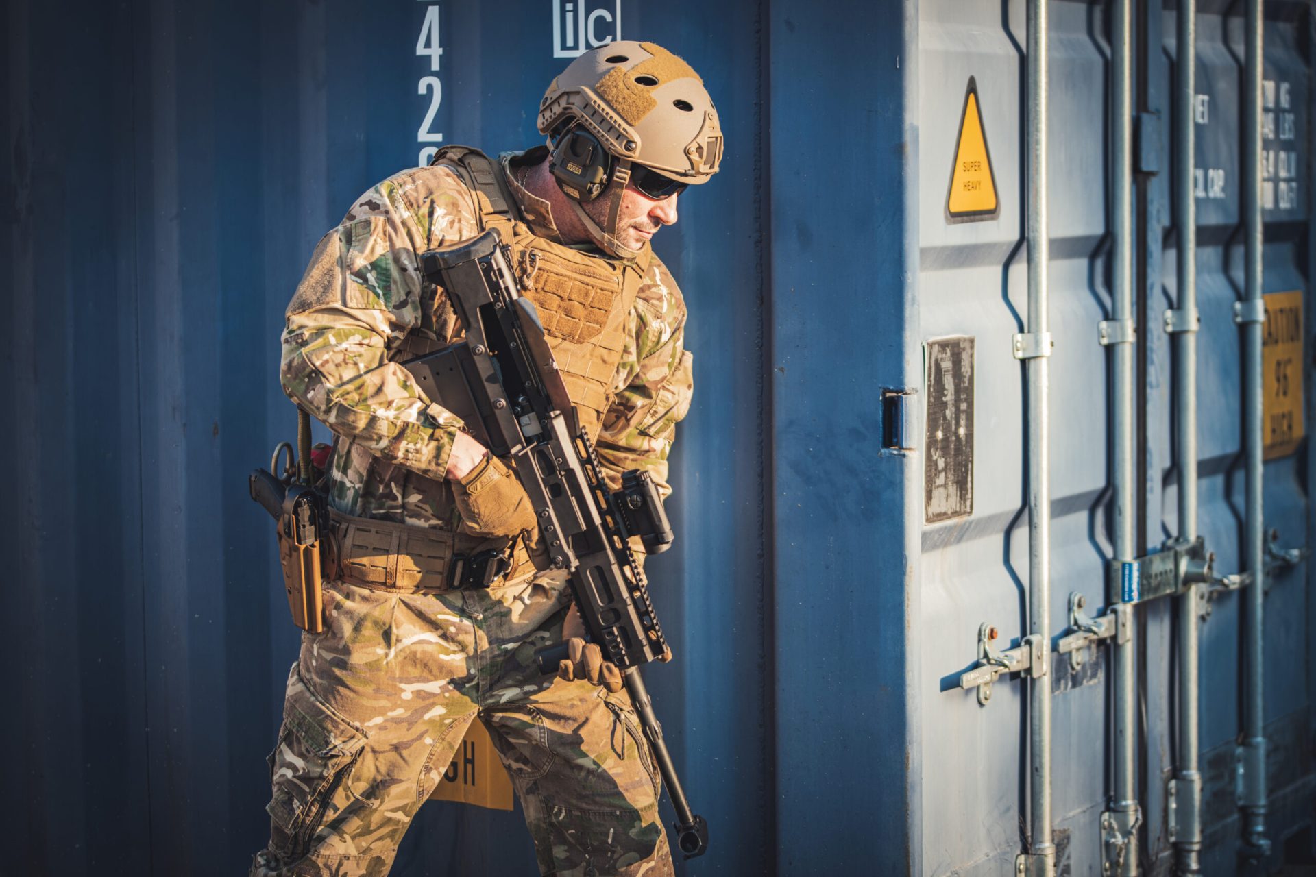 Operator with the HH50 alongside shipping containers